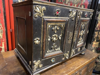 An ebonised and inlaid wooden cabinet, 19th C.