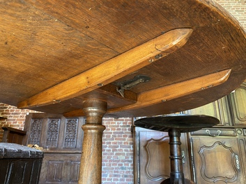 An English oak folding table, 19th C.