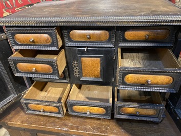 An ebonised and inlaid wooden cabinet, 19th C.