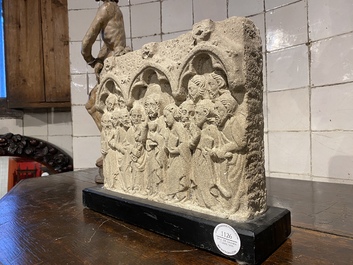 A sandstone relief depicting Christ and the twelve apostles, 20th C.