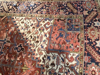 A large rectangular ornamental Heriz rug, 1st half 20th C.