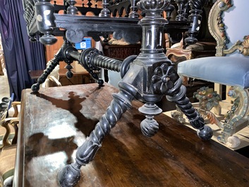 An attractive ebony-inlaid ebonised wooden cradle, 19th C.