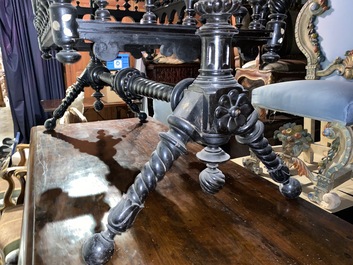 An attractive ebony-inlaid ebonised wooden cradle, 19th C.