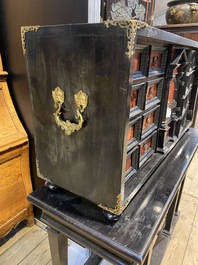 An ebonised wooden cabinet with faux-tortoiseshell veneer, 19th C.