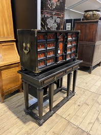 An ebonised wooden cabinet with faux-tortoiseshell veneer, 19th C.