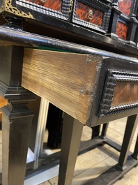 An ebonised wooden cabinet with faux-tortoiseshell veneer, 19th C.