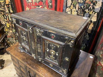 An ebonised and inlaid wooden cabinet, 19th C.