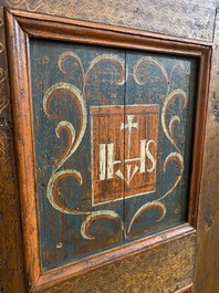 A German polychrome pine single-door cupboard, 18/19th C.