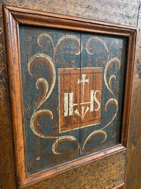 A German polychrome pine single-door cupboard, 18/19th C.