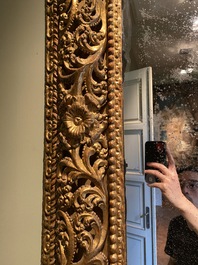 A finely carved gilt wooden mirror, probably Italy, 17/18th C.