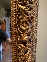 A finely carved gilt wooden mirror, probably Italy, 17/18th C.