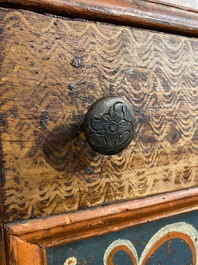 A German polychrome pine single-door cupboard, 18/19th C.