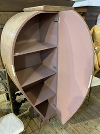 A light pink leather-clad two-door cabinet, 20th C.