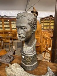 A bronze male bust on a marble base, 20th C.