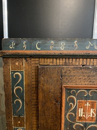 A German polychrome pine single-door cupboard, 18/19th C.