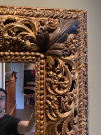 A finely carved gilt wooden mirror, probably Italy, 17/18th C.