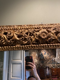 A finely carved gilt wooden mirror, probably Italy, 17/18th C.