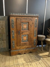 A German polychrome pine single-door cupboard, 18/19th C.