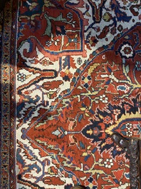 A large rectangular ornamental Heriz rug, 1st half 20th C.