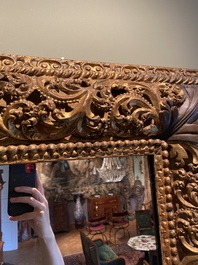 A finely carved gilt wooden mirror, probably Italy, 17/18th C.