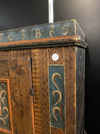 A German polychrome pine single-door cupboard, 18/19th C.