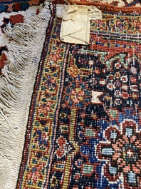 A large rectangular ornamental Heriz rug, 1st half 20th C.