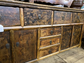 A Chinese elmwood sideboard, 19/20th C.