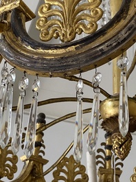 Een Duitse vergulde metalen, houten en geslepen glazen luchter met tien lichtpunten naar ontwerp van Karl Friedrich Schinkel, ca. 1830
