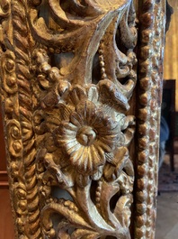 A finely carved gilt wooden mirror, probably Italy, 17/18th C.