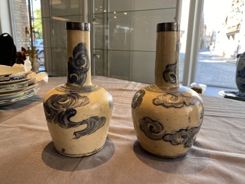 A pair of Vietnamese Bat Trang stoneware bottle vases with clouds, 19th C.