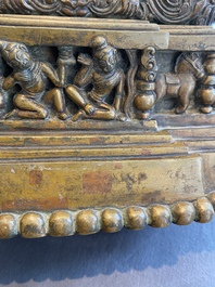 A large Tibetan brass and copper Buddha on throne, probably 16th C.