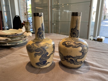 A pair of Vietnamese Bat Trang stoneware bottle vases with clouds, 19th C.