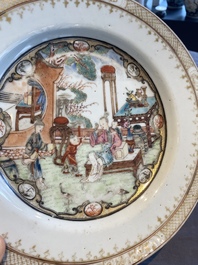 A fine Chinese famille rose plate with two ladies and two boys in an interior, Yongzheng/Qianlong