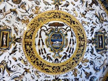 A large Italian maiolica dish with the arms of Cardinal Toschi, Deruta, dated 1609