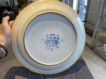 A large Italian maiolica dish with the arms of Cardinal Toschi, Deruta, dated 1609