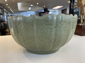 A large Chinese Longquan celadon bowl with underglaze lotus design, Ming