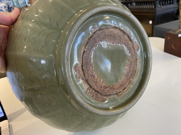 A large Chinese Longquan celadon bowl with underglaze lotus design, Ming