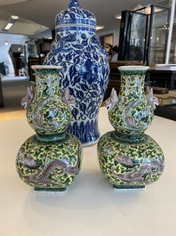 A pair of Chinese famille verte double gourd vases and a blue and white vase and cover, 19/20th C.