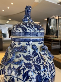 A pair of Chinese famille verte double gourd vases and a blue and white vase and cover, 19/20th C.