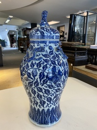 A pair of Chinese famille verte double gourd vases and a blue and white vase and cover, 19/20th C.