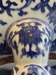 A large Chinese blue and white 'bajixiang' tripod censer with lotus scrolls, Qianlong