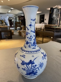A Chinese blue and white bottle vase with a dragon on the neck, Transitional period