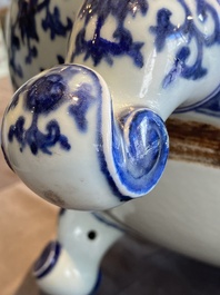 A large Chinese blue and white 'bajixiang' tripod censer with lotus scrolls, Qianlong