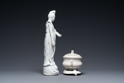 A Chinese Dehua blanc de Chine figure of Guanyin and a covered censer on stand, 18/19th C.