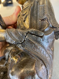Een Chinese deels vergulde bronzen Guanyin met jongen, Ming