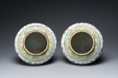 A pair of Chinese famille rose 'antiquities' vases and covers, 19th C.