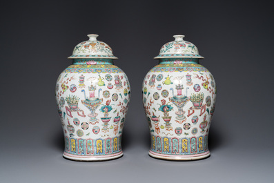 A pair of Chinese famille rose 'antiquities' vases and covers, 19th C.