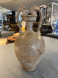 A Chinese straw-glazed stoneware amphora with dragon handles, Tang