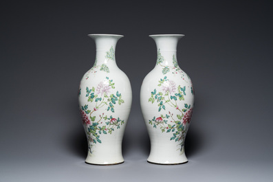 A pair of Chinese famille rose vases with floral design, Qianlong mark, 19/20th C.