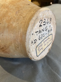 A Chinese straw-glazed stoneware amphora with dragon handles, Tang